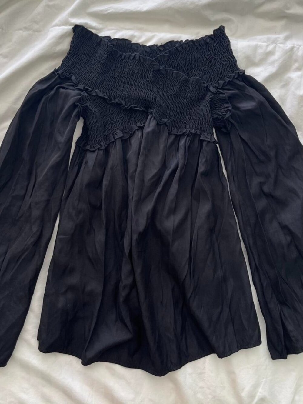 black off the shoulder flowy mini dress with long sleeves